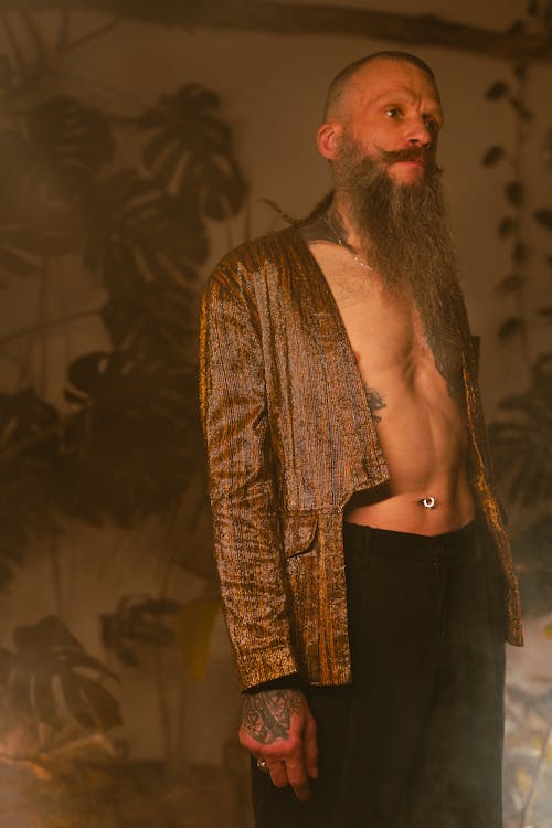 Photo of Man Wearing Copper Colored Blazer