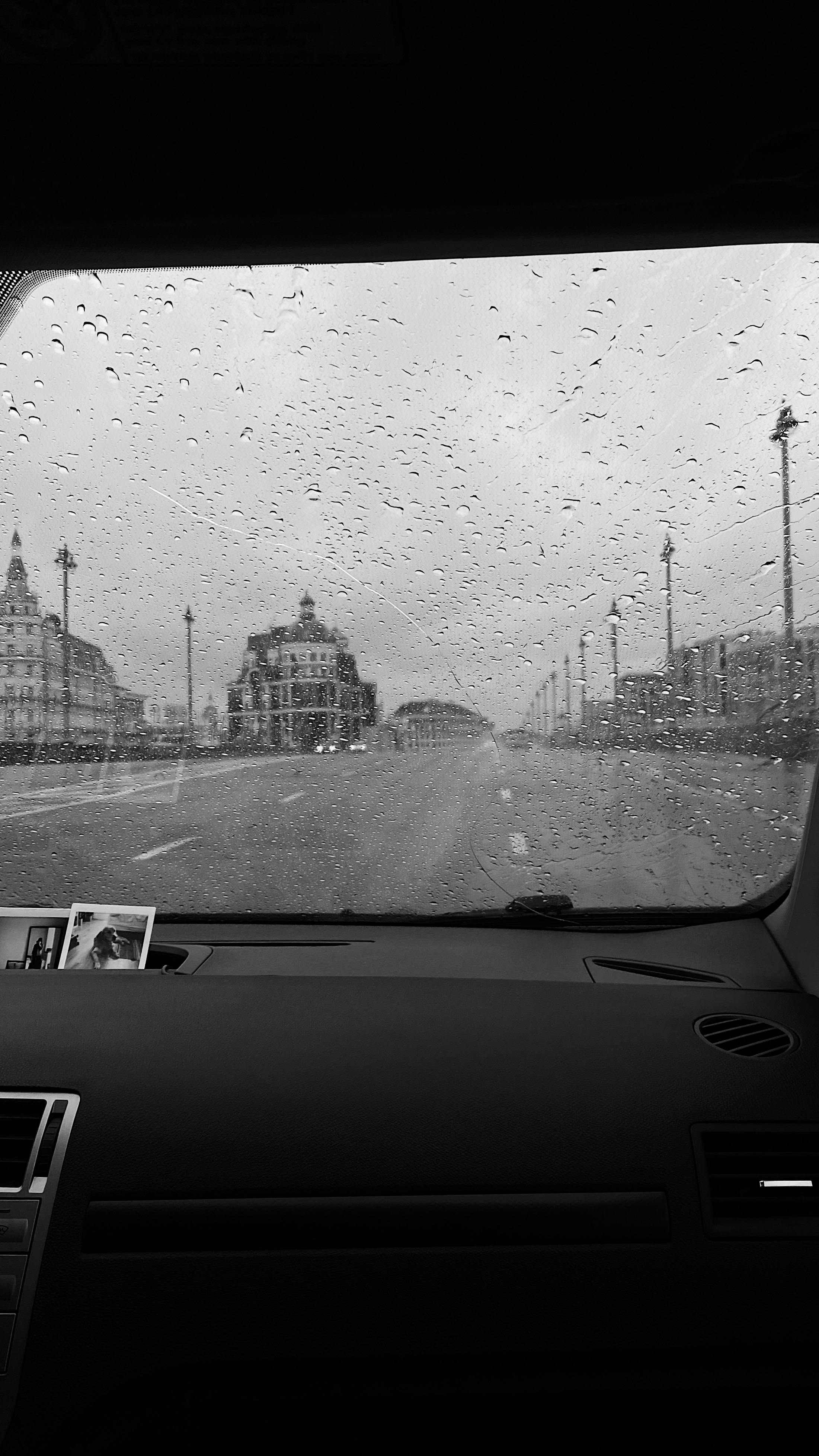 pov of automobile driving on road in rain