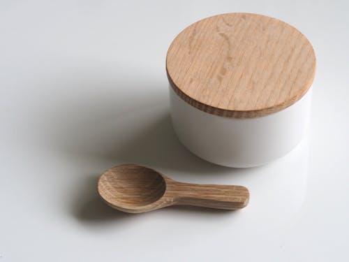 Free Close-up Photography of White and Brown Wooden Container and Spoon Stock Photo