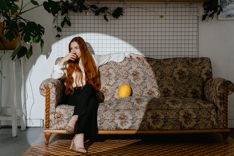 Woman Eating A Fruit