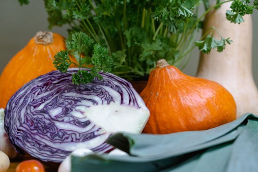 Colorful assortment of fresh vegetables including pumpkin, red cabbage, and parsley highlighting healthy eating.