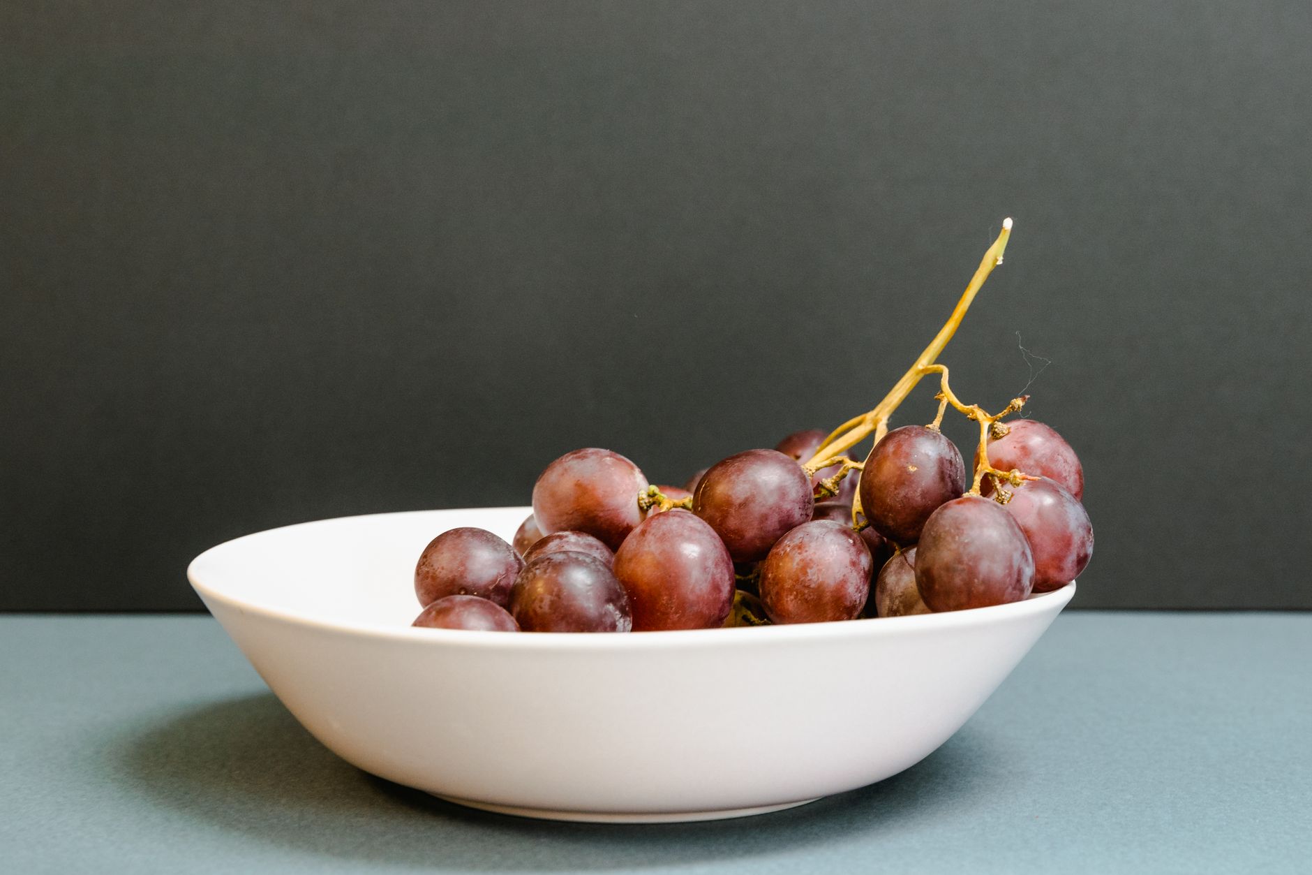 Purple grapes in a bowl, a useful visual reminder that the study question was whole-grape nutrition rather than a purified resveratrol pill