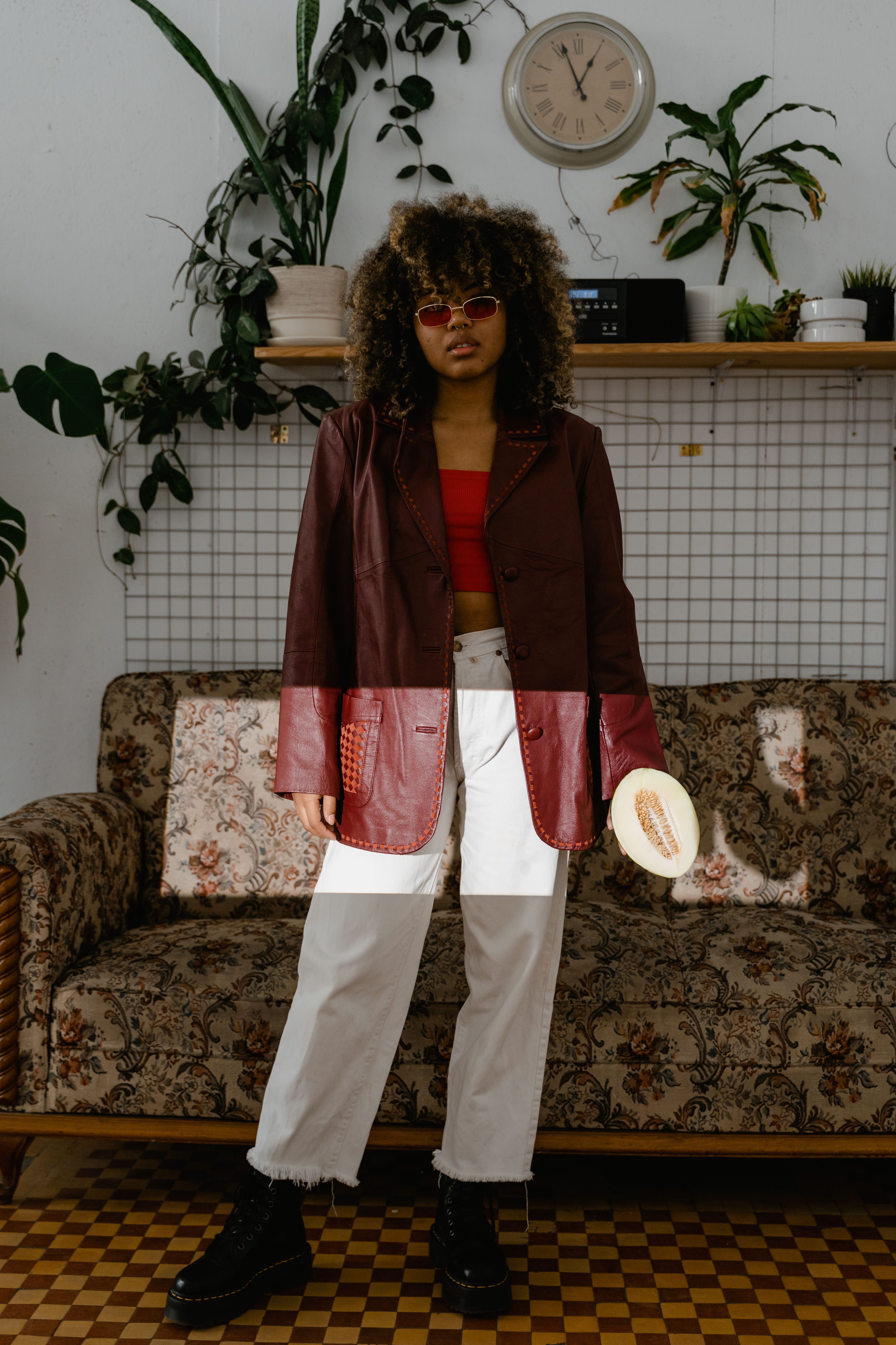 Woman in leather jacket chic outfit indoors