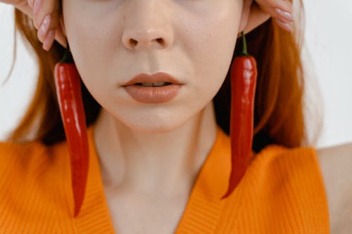 Free Close-up Shot of a Woman wearing Chili Earrings Stock Photo