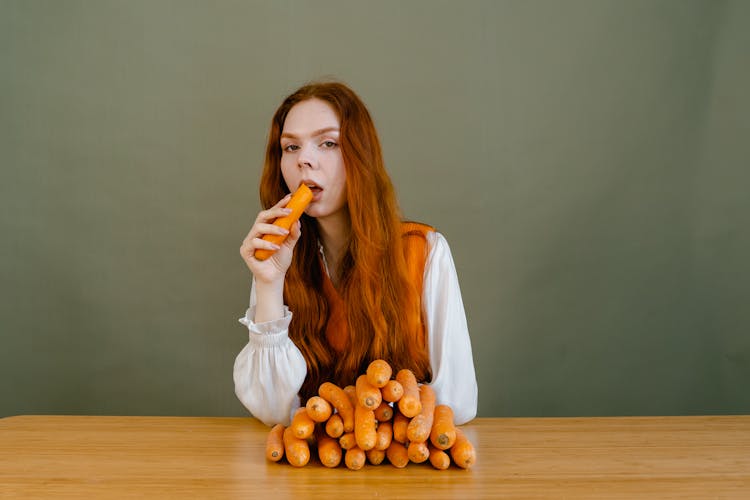 A Woman Eating Carrot