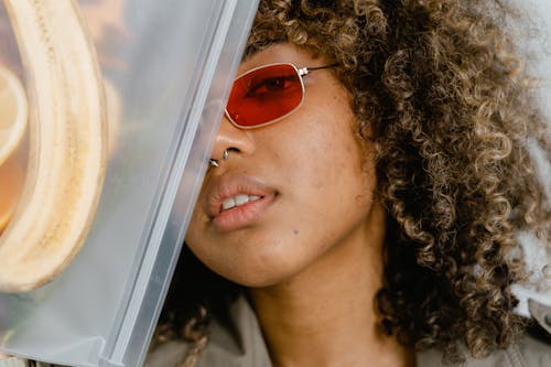 Close-up of a Curly Woman Wearing Sunglasses