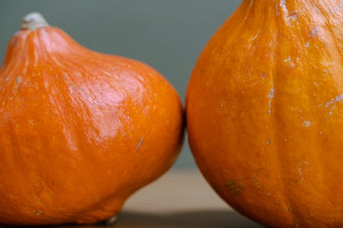 Two Orange Fruits on White Table
