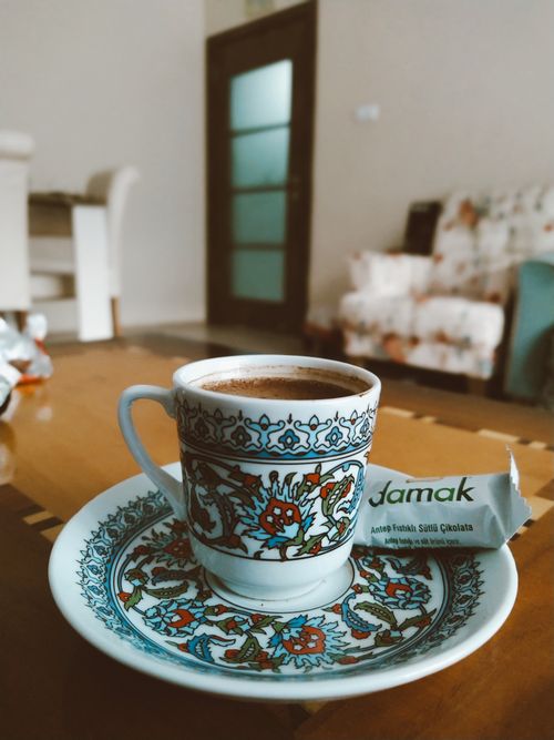 Free Close-up of ornate coffee cup with delicate patterns, capturing a cozy indoor ambiance. Stock Photo