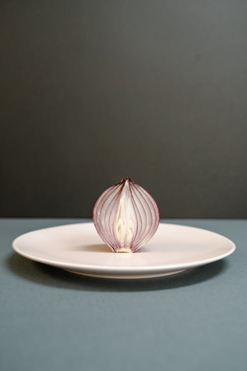 Free Sliced Onion on a Plate Stock Photo