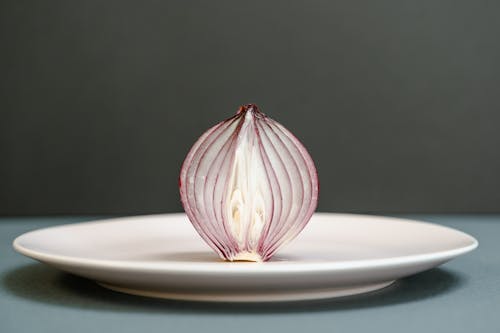 Sliced Red Onion on a Ceramic Plate