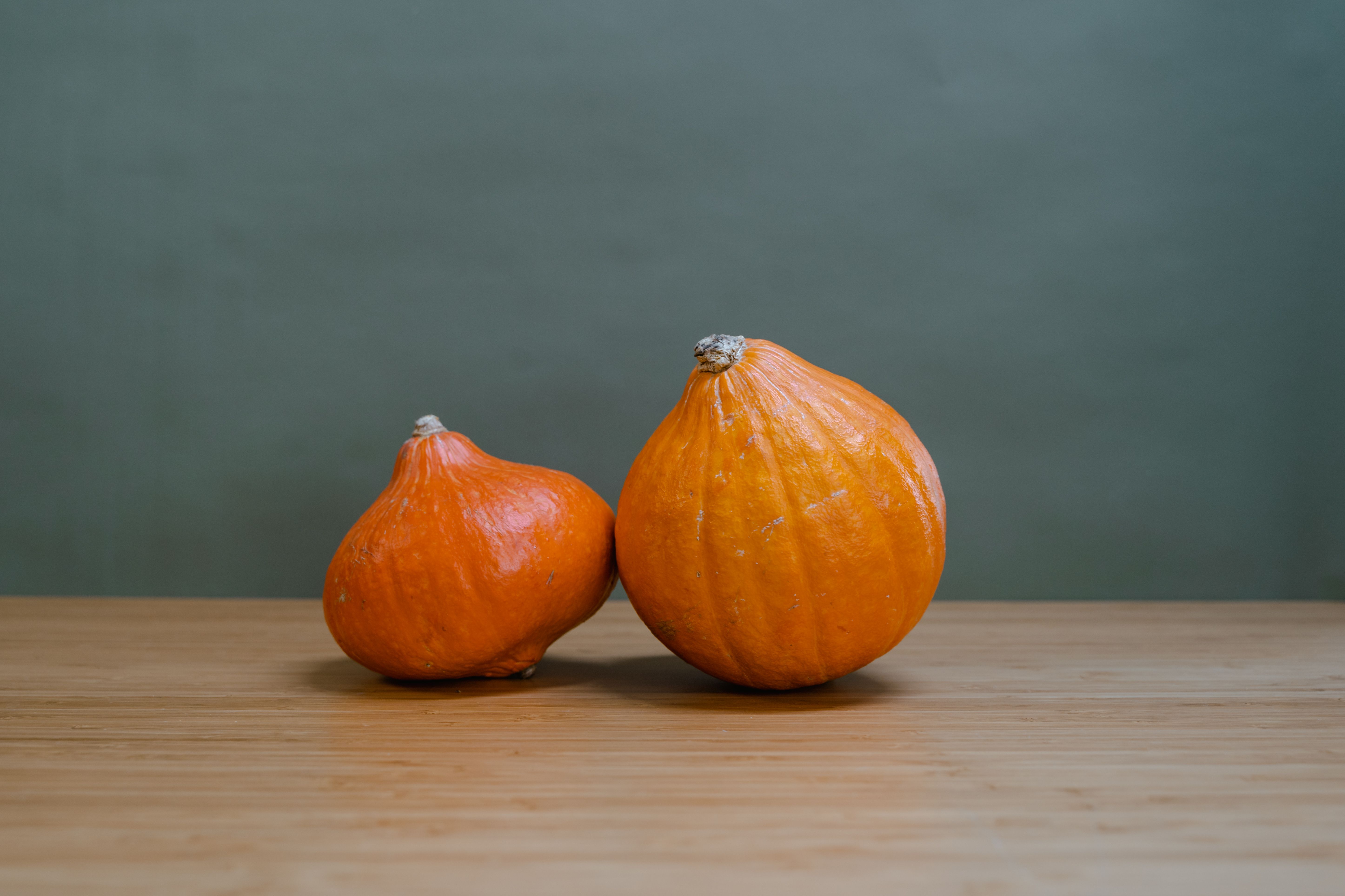 Orange Pumpkins on Brown Wooden Table · Free Stock Photo