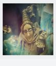 Hindu Deity Statue in Front of White Wall