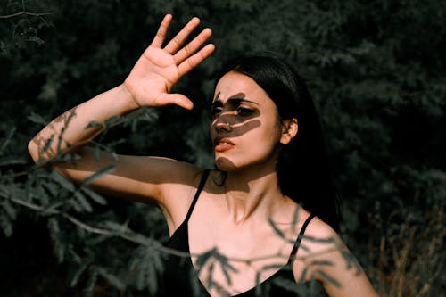 Beautiful Woman Covering Face with Shadow