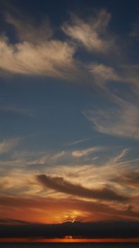 Captivating sunset with dramatic clouds over Marseille, highlighting an intense evening skyscape.