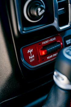 Detailed view of automotive dashboard buttons and controls with selective focus.