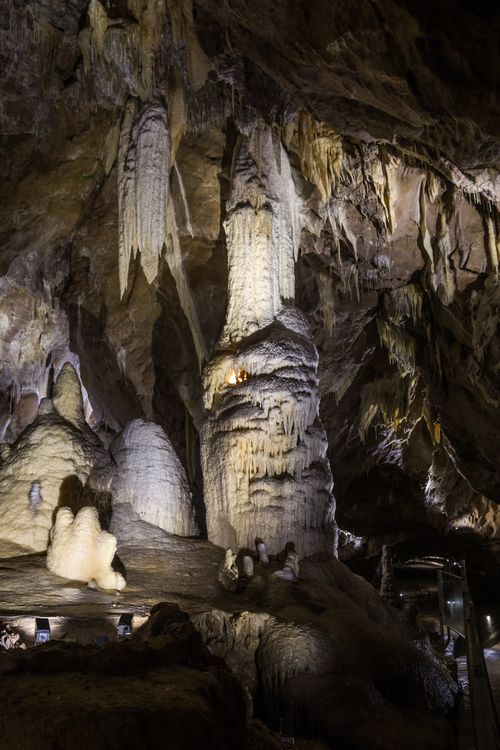 Free Explore breathtaking stalactites and stalagmites in this dimly lit cave. Stock Photo
