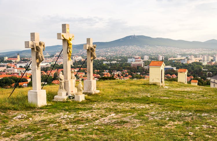 Jesus Christ Cross On Calvary With Town Of Nitra And Zobor Mountain On Background