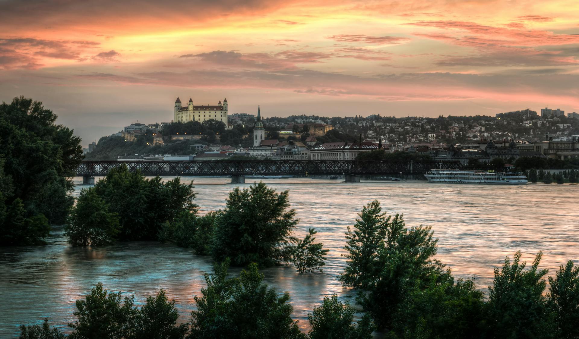 High Water Level on the Danube River with View of Bratislava Castle on Background during Sunset  in Bratislava, Slovakia