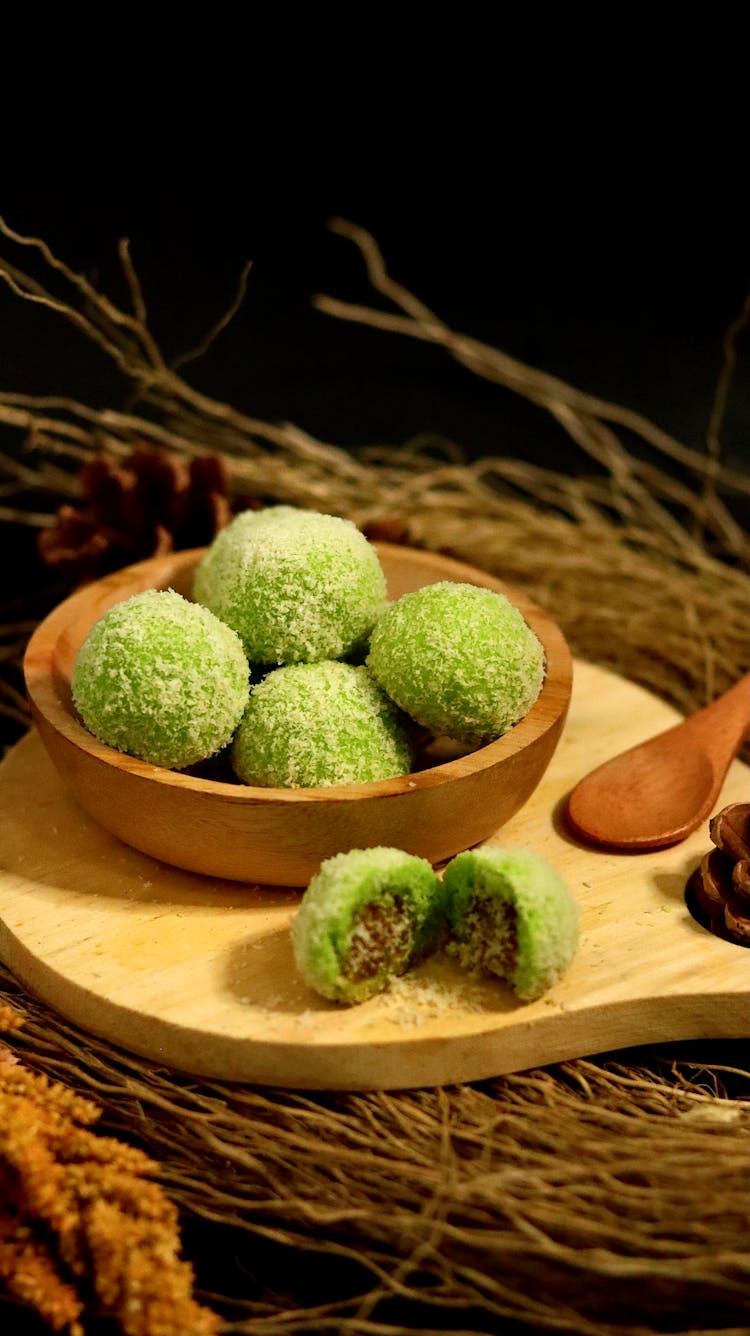 Matcha And Coconut Truffles In A Wooden Bowl