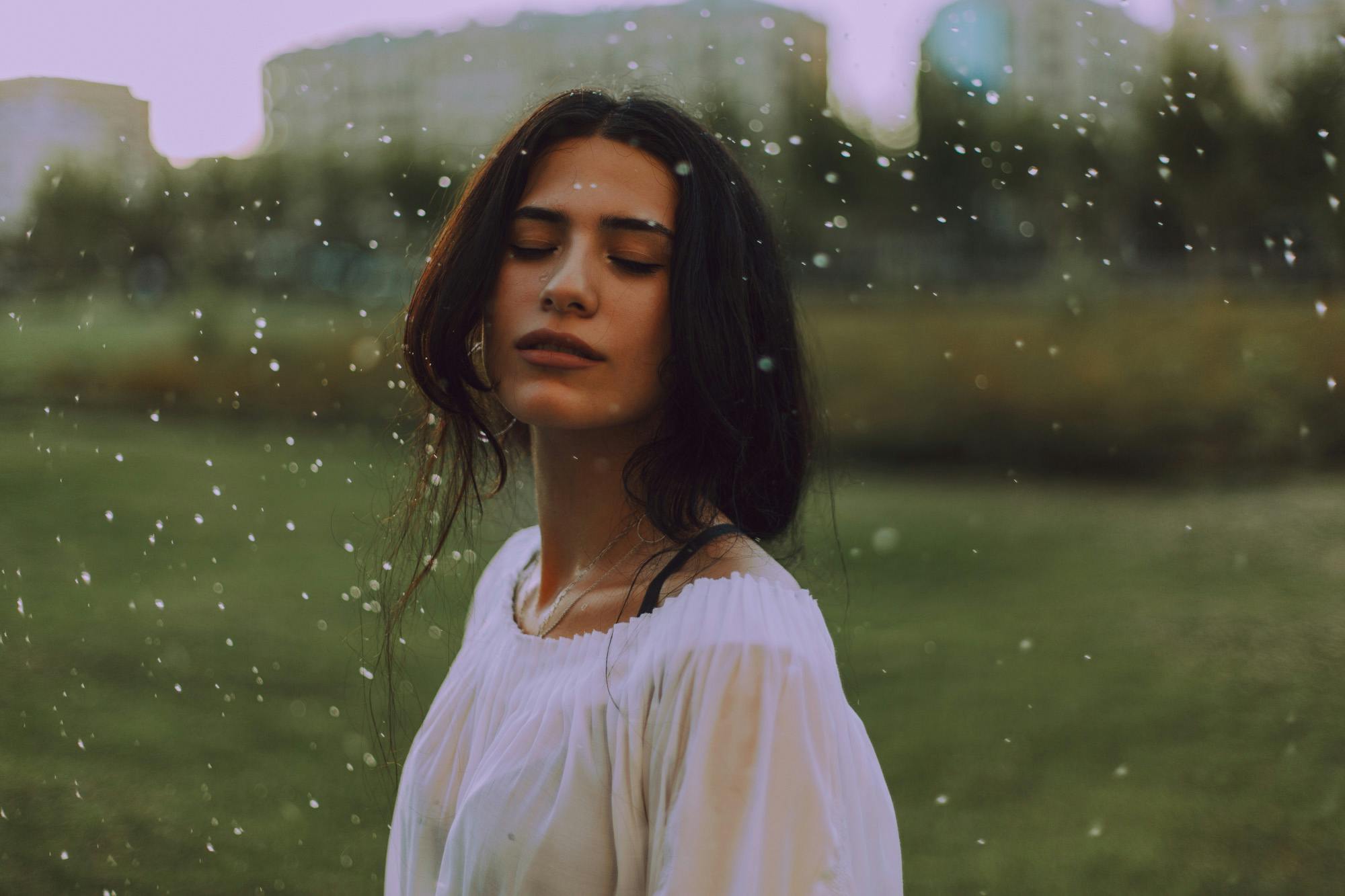 Woman in White Shirt With Green Background