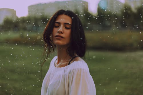 Woman in White Shirt With Green Background