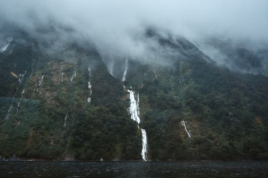 Waterfalls on Mountain in Milford Sound, Fiordland, New Zealand
