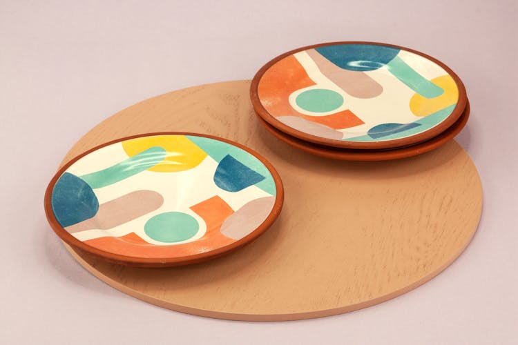 Colorful Plates On A Wooden Board