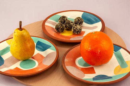 Fresh Fruits and Food on Ceramic Bowls
