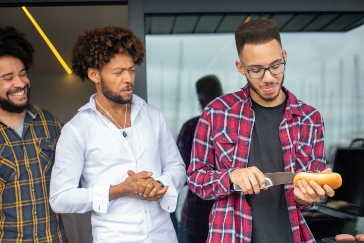 A Man Slicing A Bread 