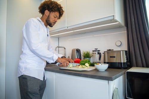 A Man Cutting a Vegetable