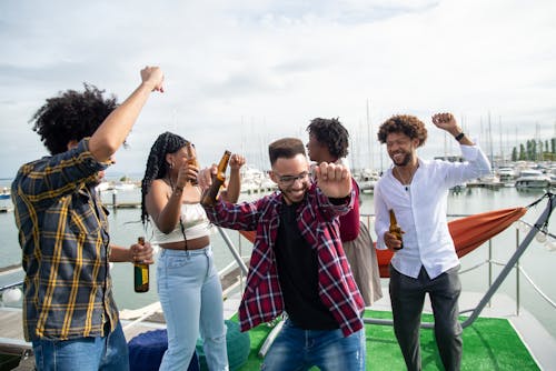 Group of Friends Having a Party at the Harbor