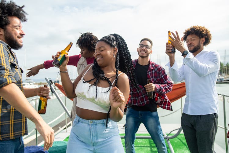 Smiling Friends With Beer On Boat