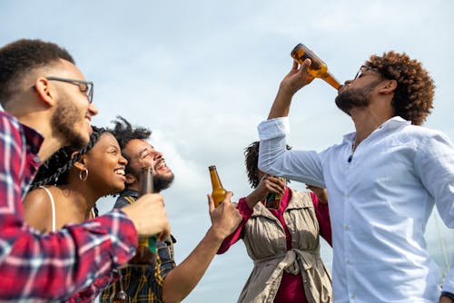 A Group of Friends Having Fun while Drinking Beer