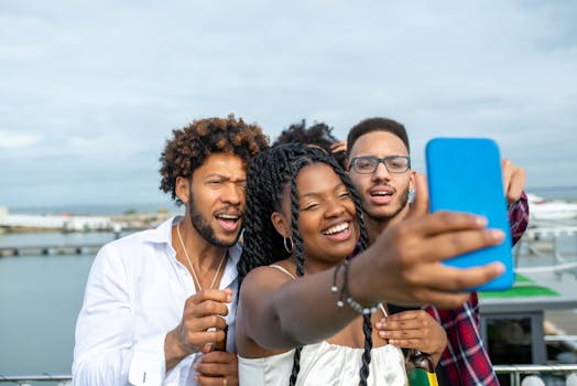 Three friends joyfully taking a selfie outdoors, capturing a happy moment in Portugal.