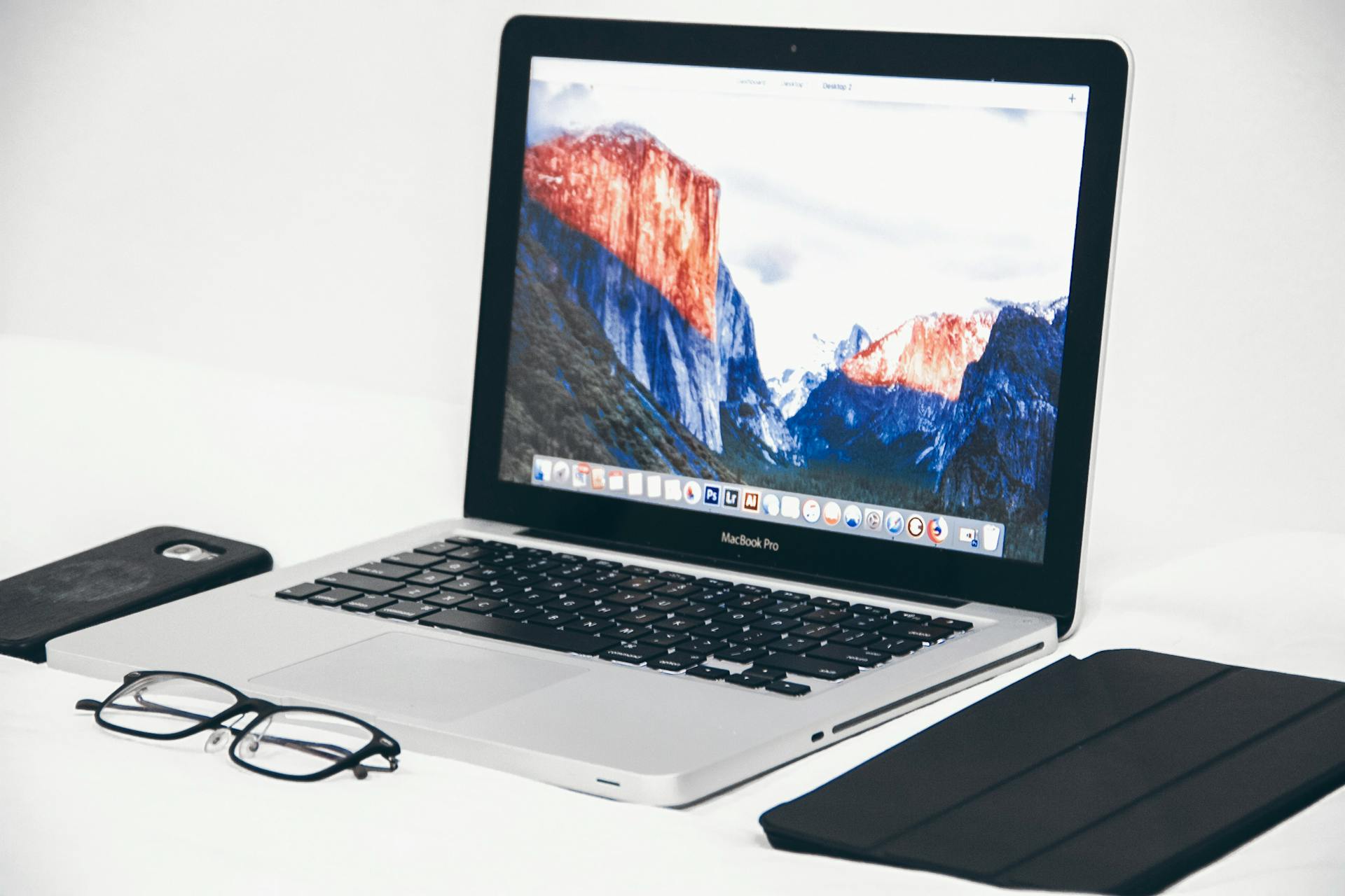 Eyeglasses Beside a Laptop