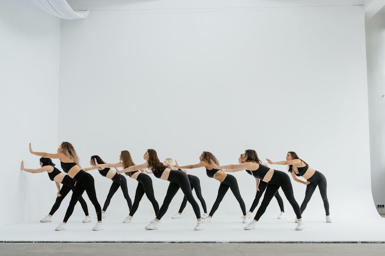 Group Of Women Dancing On White Background