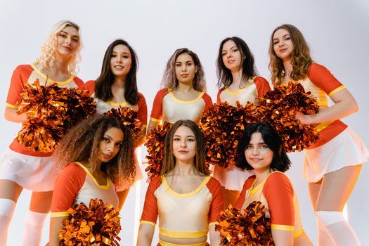 3 Women in Yellow and Orange Dresses