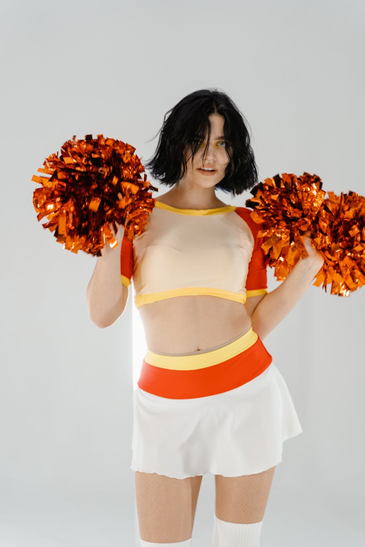 Cheerleader With Orange Pompoms