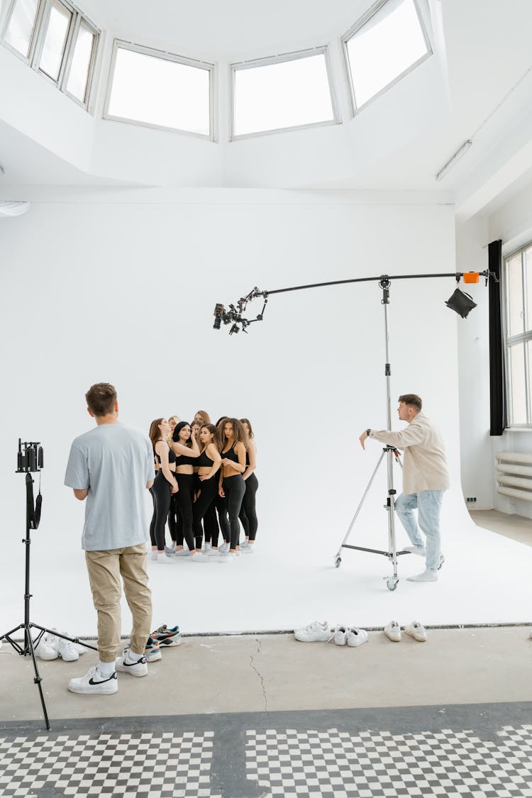 Group Of Women In Black Top And Leggings In A Studio Shoot