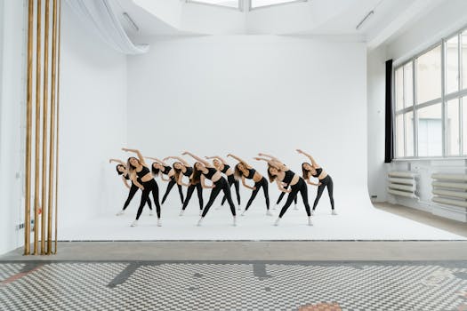 Group of women exercising in a bright studio space. Perfect for fitness and lifestyle themes.