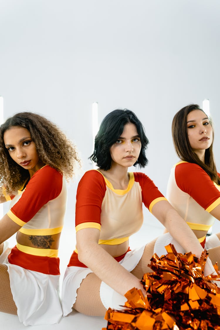 Cheerleaders Sitting On The Floor