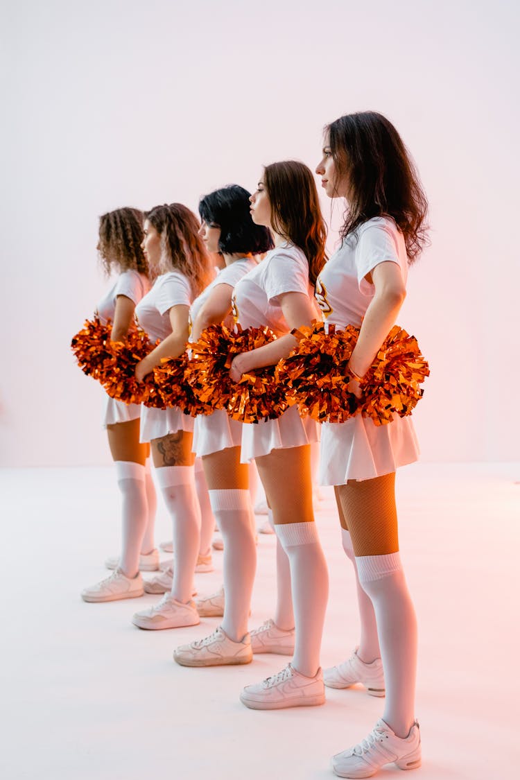 Cheerleaders Holding Pom-Poms