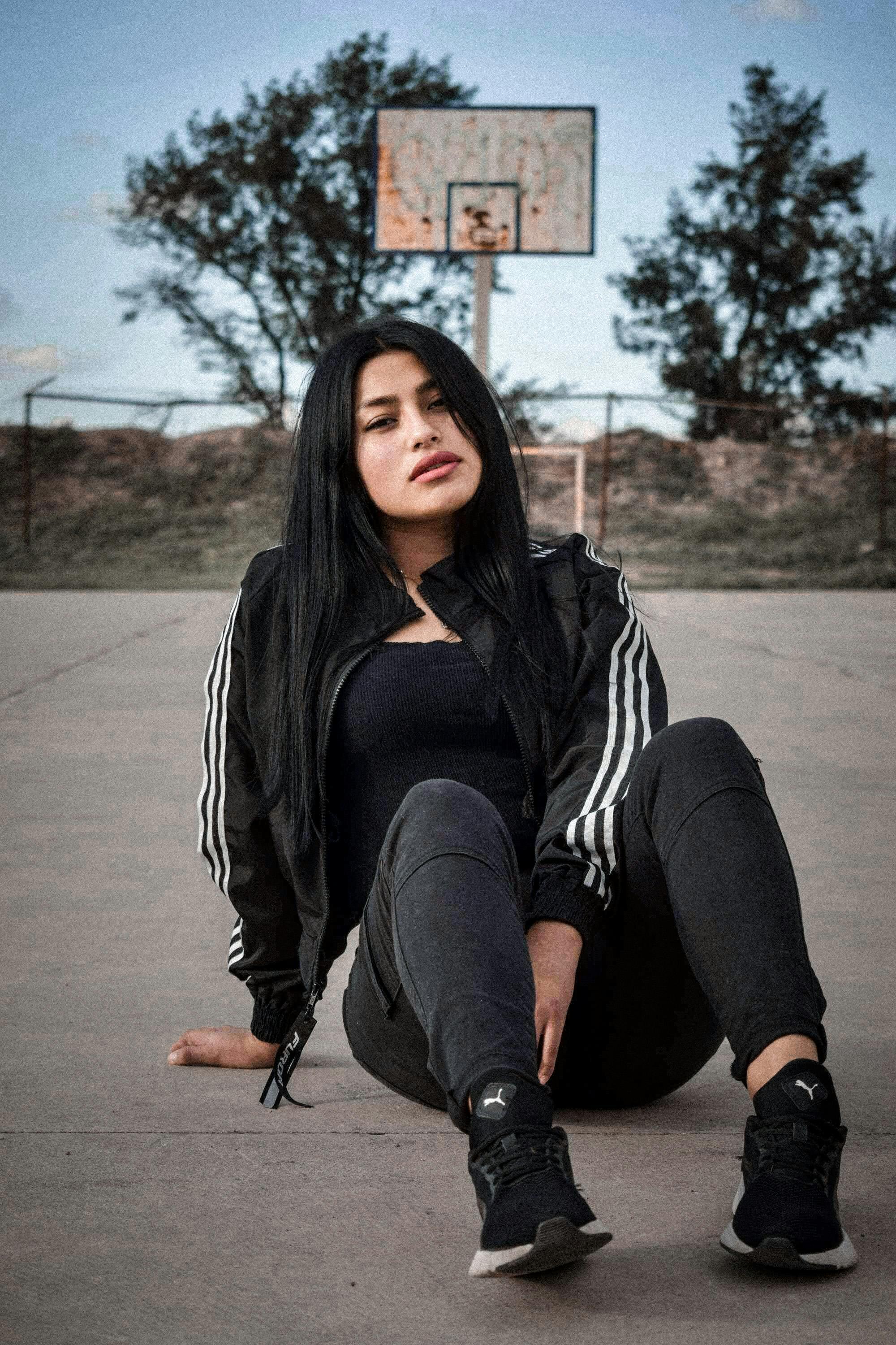Woman in Blue on Track Field Bench · Free Stock Photo