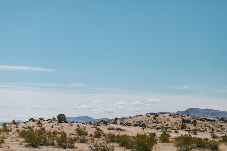 Rocky Dirt Ground Under A Blue Sky