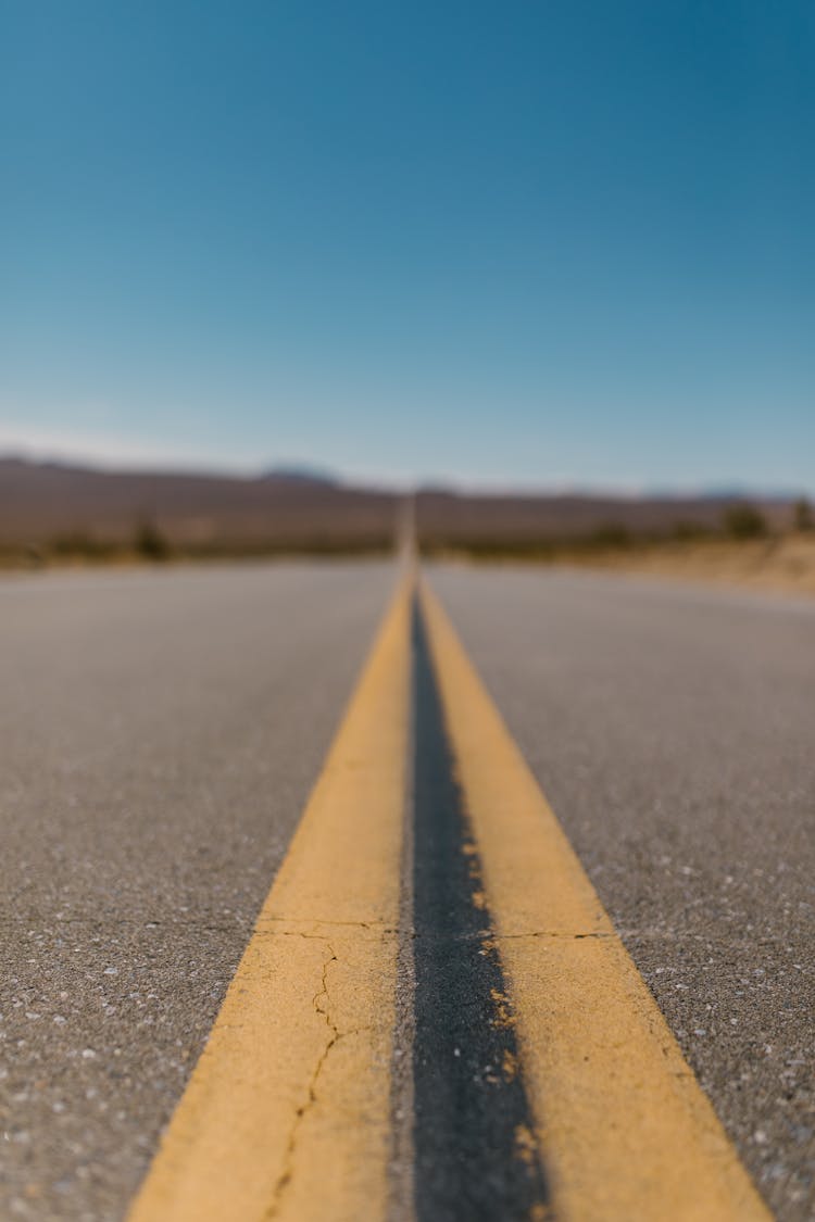 Yellow And Black Line On A Straight Road