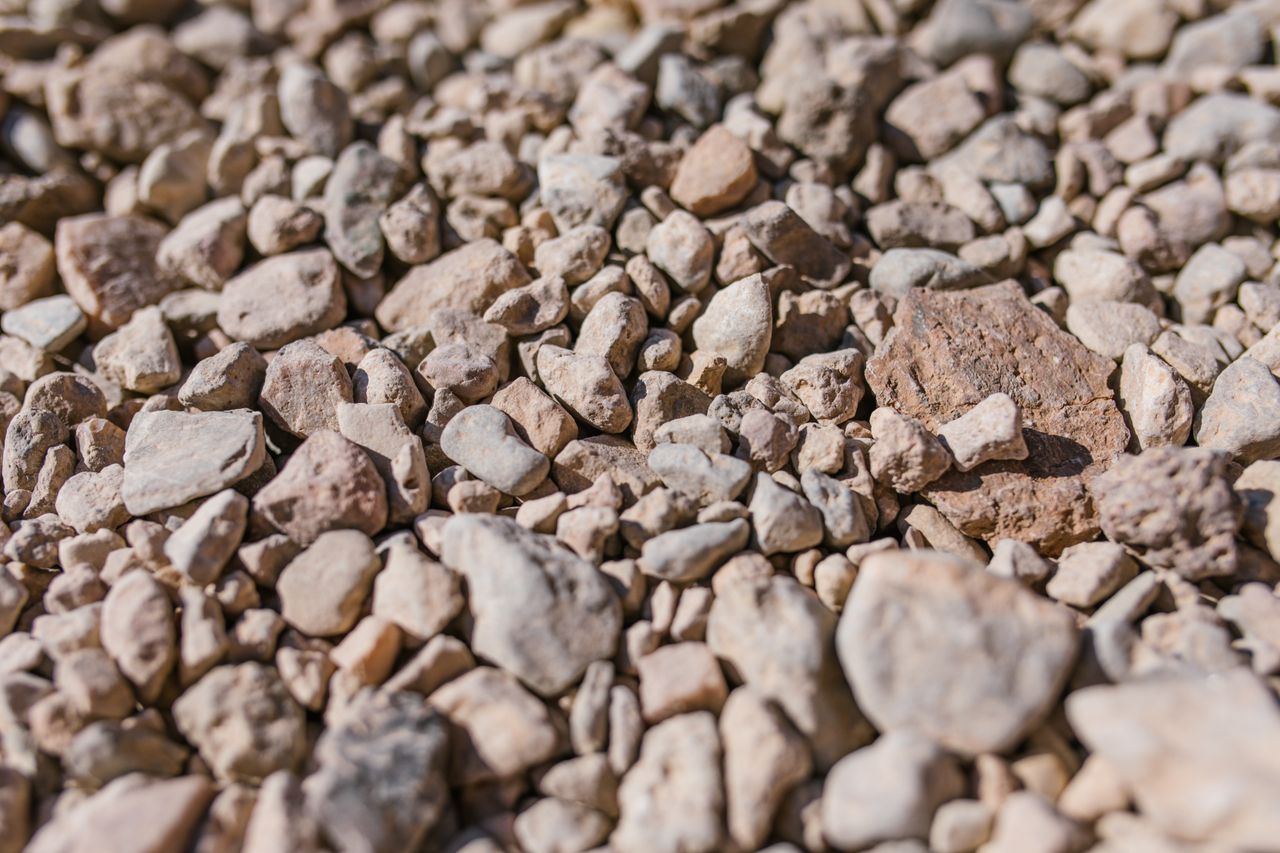 detailed view of natural gravel stones showcasing their texture and va