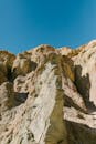 Brown Rocky Mountain Under Blue Sky