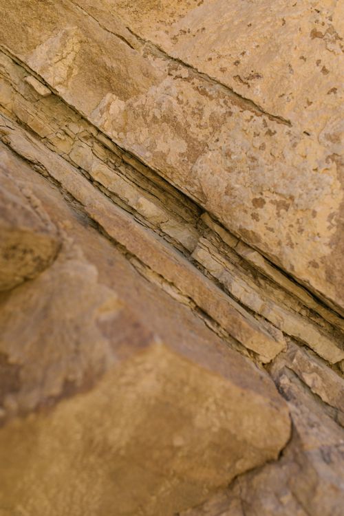 Free Detailed view of an eroded rock surface showcasing natural textures and formations. Stock Photo