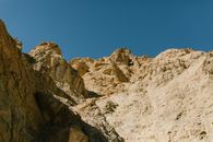 Brown Rocky Mountain Under Blue Sky