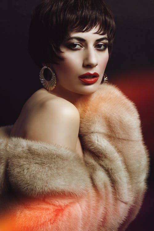 Woman in Brown Fur Coat with Round Earrings